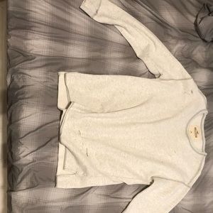 Long sleeve distressed Hollister shirt.